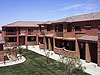 A building with many windows and doors on the outside.