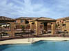 A pool with a swimming area and a building