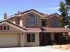 A large house with two stories and a garage.